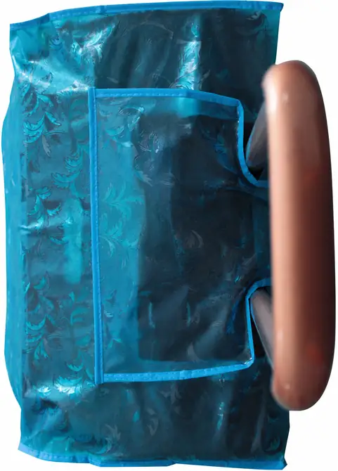 Complete side view of a blue floral EVA luggage cover showing suitcase body, handle opening, pocket and bound edges