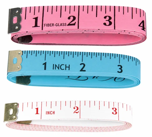 Coiled flexible measuring tape in four colors with blade width, edge and scale layout visible