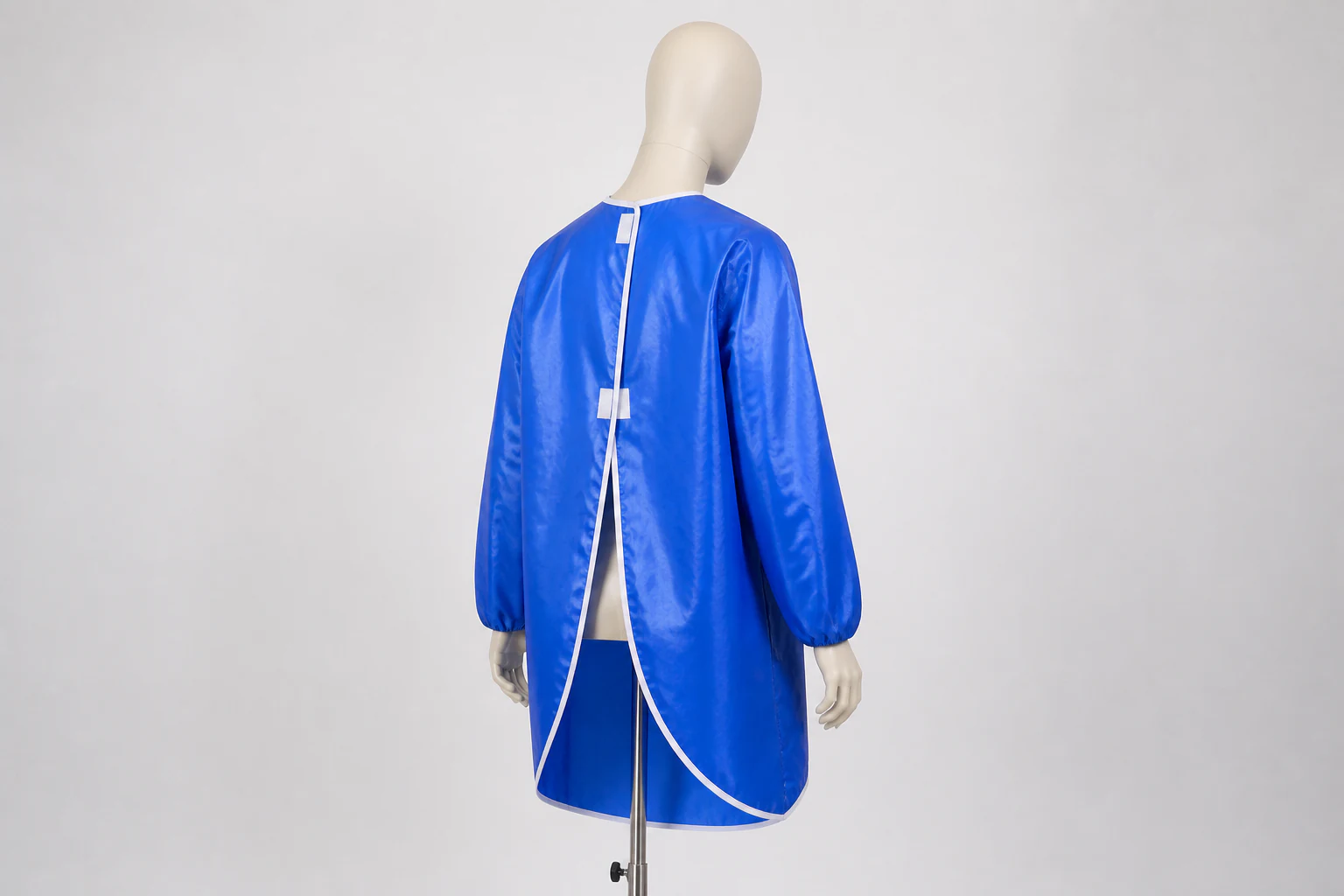 Complete royal blue coated work smock shown from the rear with open back and fasteners visible