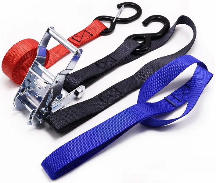 Red, black and blue ratchet strap interfaces compare hook forms, webbing colors and loop construction.
