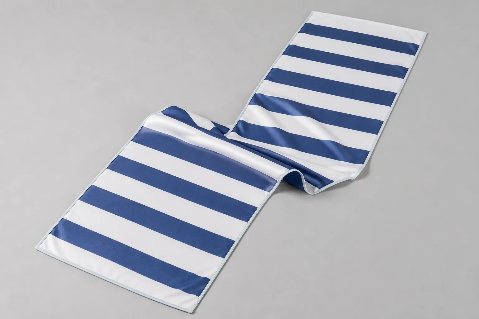 Complete unbranded navy and white striped lightweight towel with both finished ends visible
